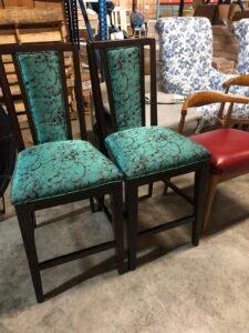 Cyan Coloured chair fabric with design